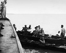 SI agents board P-563, a Maritime Unit fast-boat, off the Burma Coast in 1945. 