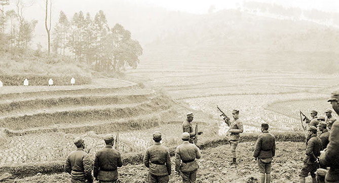 CPT Walter R. Mansfield of Team MUSKRAT instructs Chinese troops on the use of the Thompson sub-machinegun, China 1945.
