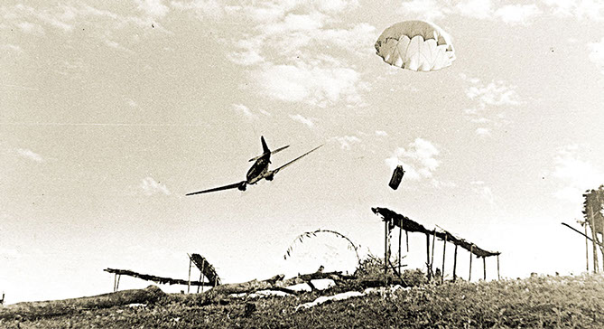 Communications personnel coordinated supply drops to the field, such as this one in north Burma in 1944.